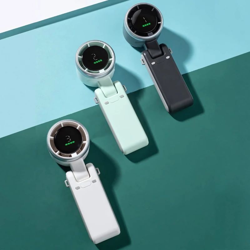 BreezeBuddy™ – Draagbare mini-ventilators in wit, mintgroen en zwart. Compact, stijlvol en verkrijgbaar via Inicala.nl.