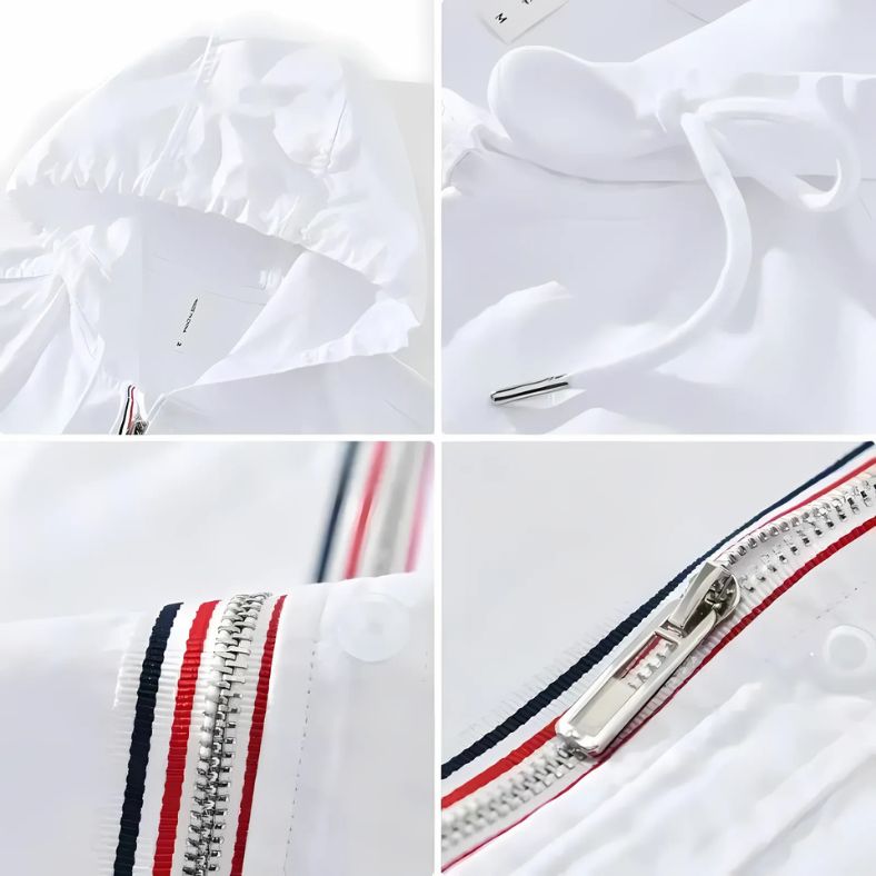 Detailfoto van de NOMORI™ – Linnen Hoodie voor de Moderne Nomad op Inicala.nl, met capuchon, trekkoord en rits met rood-wit-blauwe accenten – luchtig design voor stijl en comfort.