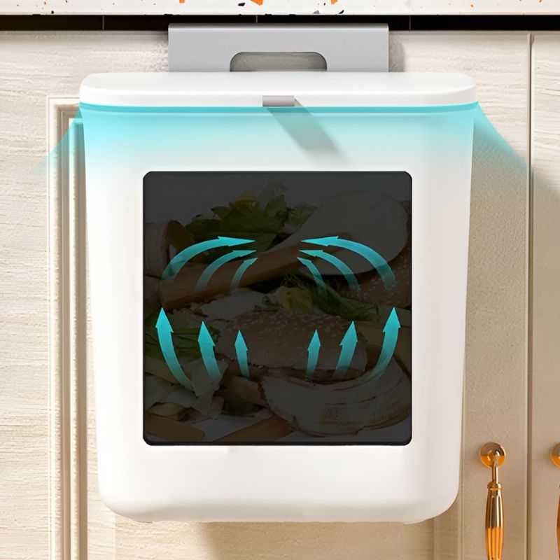 Een slanke witte wandafvalbak met een geurdichte afsluiting. Handig voor kleine keukens en monteerbaar op kasten, ontworpen om netjes afval en geurvrij op te bergen.