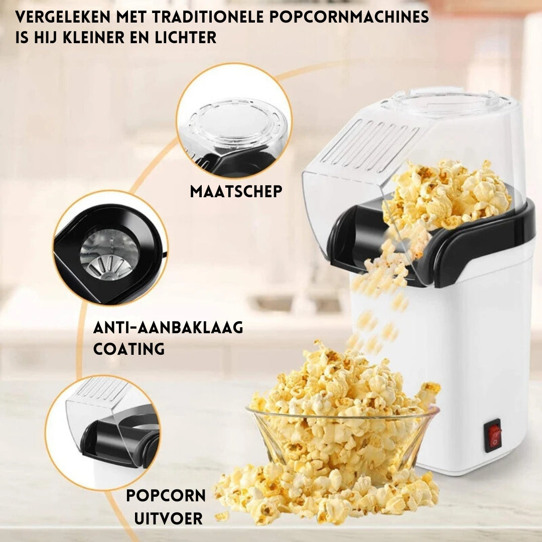 Witte PopCrisp™ popcornmaker met maatschep, anti-aanbaklaag en popcornuitvoer. Compact en licht ontwerp voor verse, vetvrije popcorn in minuten. inicala.nl