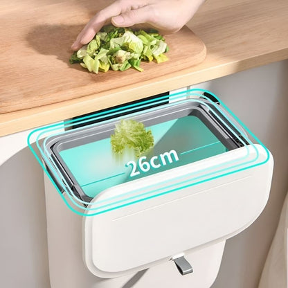Compacte HydroBin™ in actie: een handsfree afvalbak van 26 cm breed, ideaal voor keukenrestjes. Perfect te monteren aan je aanrecht voor efficiënte afvalverwerking.